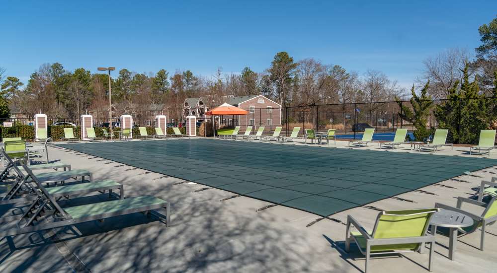 Swimming pool with multiple lounge chairs at Reserve South in Richmond, Virginia