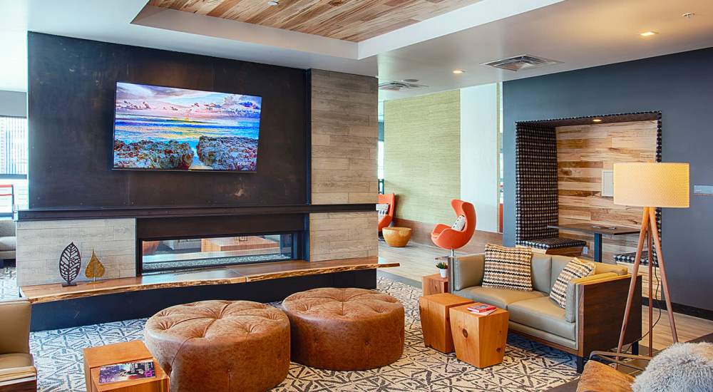 Clubhouse with seating area and a TV at SOVA on Grant in Denver, Colorado