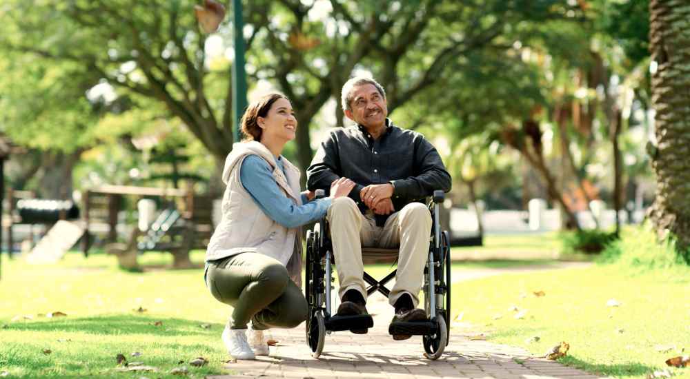 Person in a wheelchair in the park near The Preserve at Forbes Creek in Kirkland, Washington