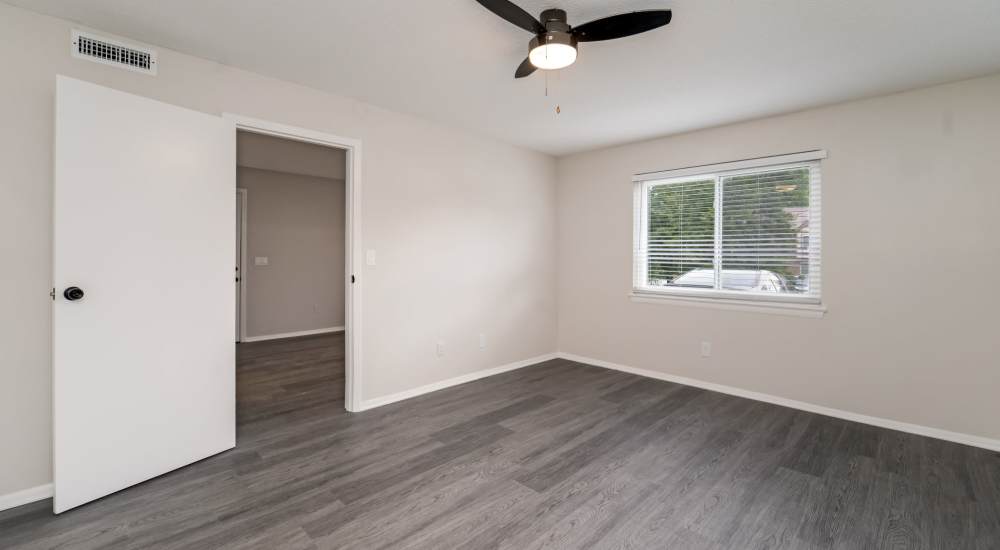 Wood style flooring and ceiling fan in the bedroom at Northside Terrace in Chattanooga, Tennessee     