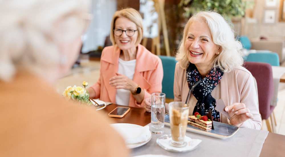 Senior woman gathering having fun at The Cascade at Foundry Creek in Richmond, Virginia