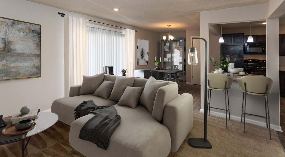 Furnished living room with a couch at Midtown Square Chattanooga Apartments in Chattanooga, Tennessee.