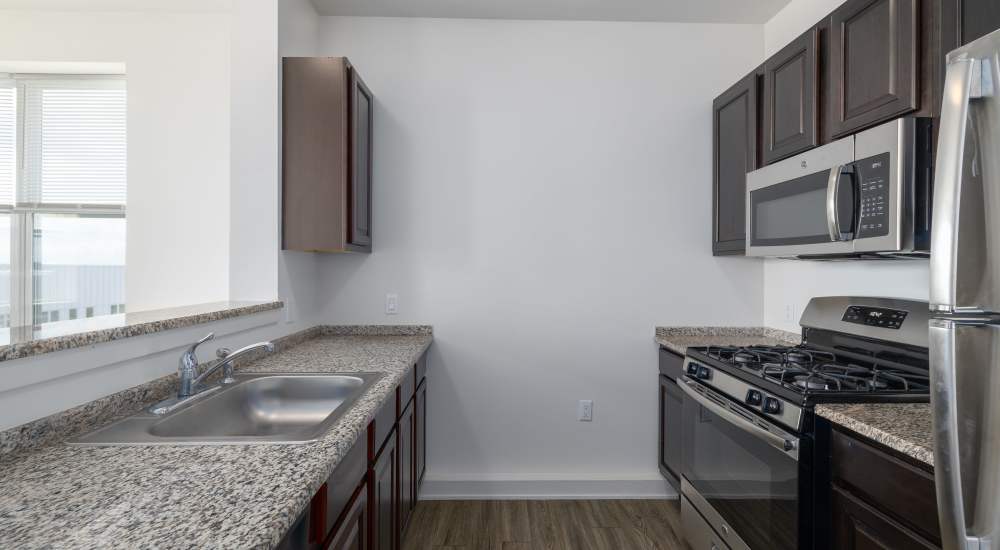 Modern-style kitchen with granite countertops at 280 Park Place in Irvington, New Jersey