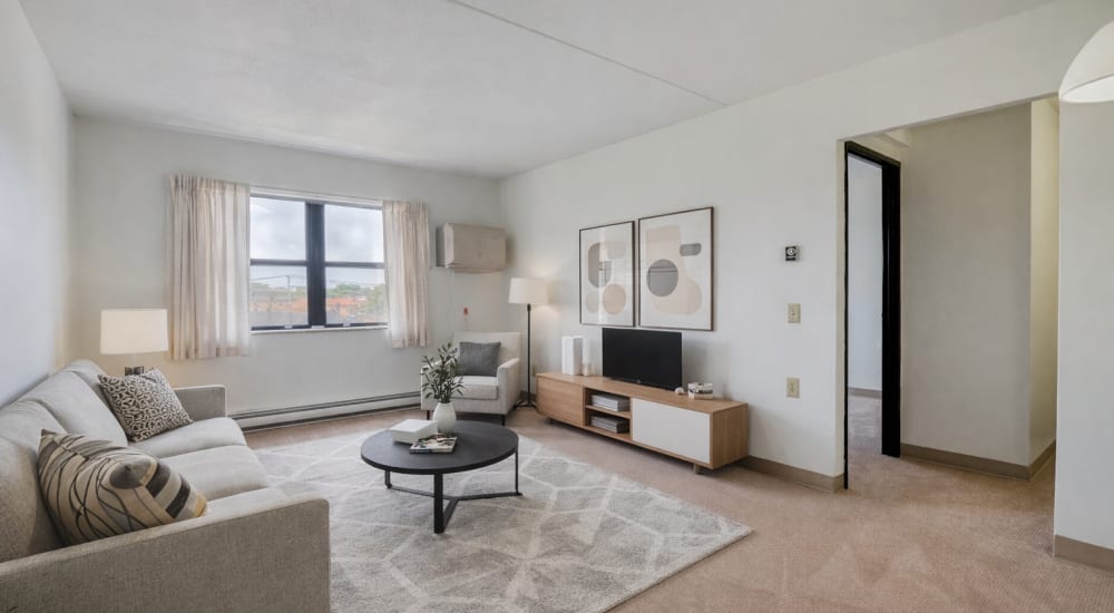 Living room featuring plush carpet at Ashtabula Towers in Ashtabula, Ohio