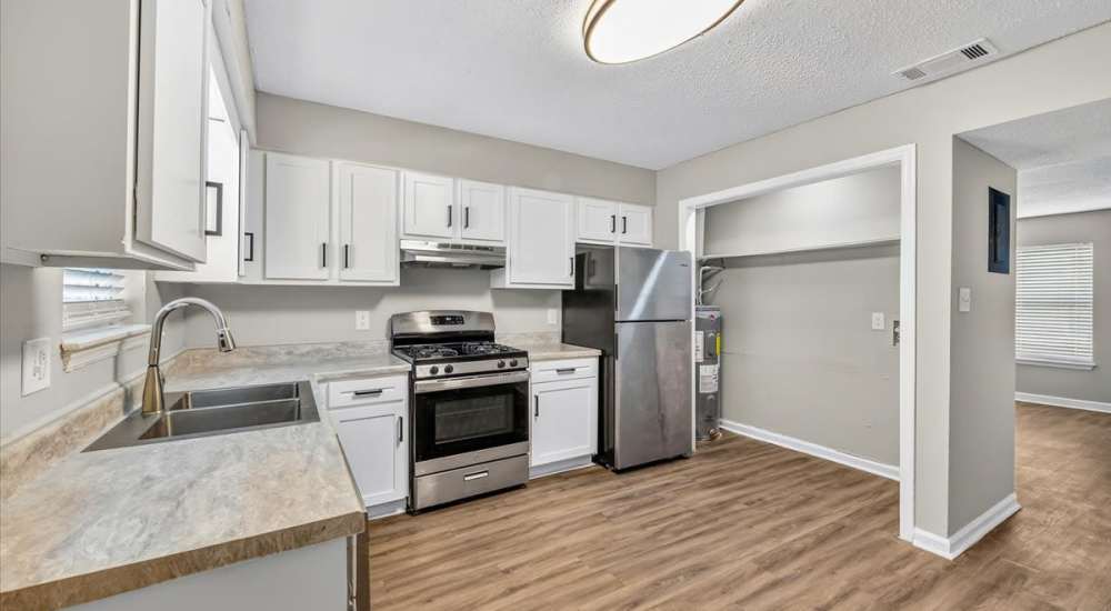 Renovated kitchen with stainless steel appliances at Tristan Townhomes in Garden City, Georgia