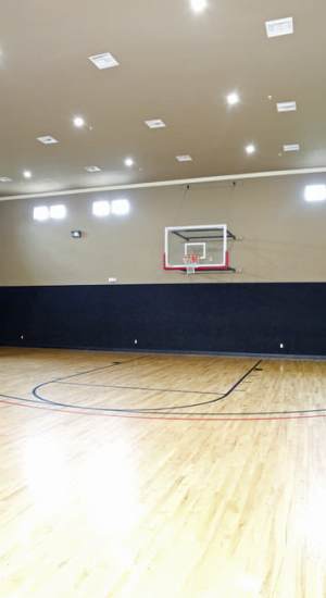 Indoor basketball court at The Abbey at Grande Oaks in San Antonio, Texas