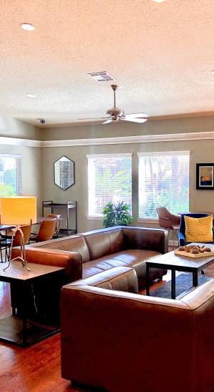 Community clubhouse with lots of seating area at The Abbey At Enclave in Houston, Texas