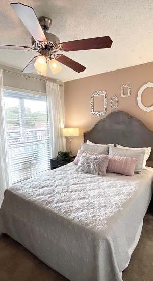 Bedroom with two-inch blinds at The Abbey at Medical Center in San Antonio, Texas  