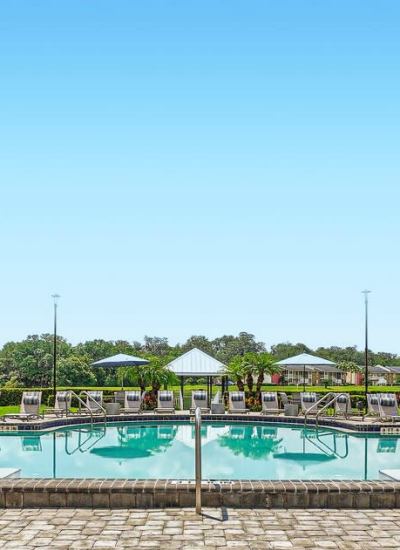 Resort-Inspired Swimming Pool, Sunning Deck & Cabanas at Lakeside Central Apartments in Brandon, Florida