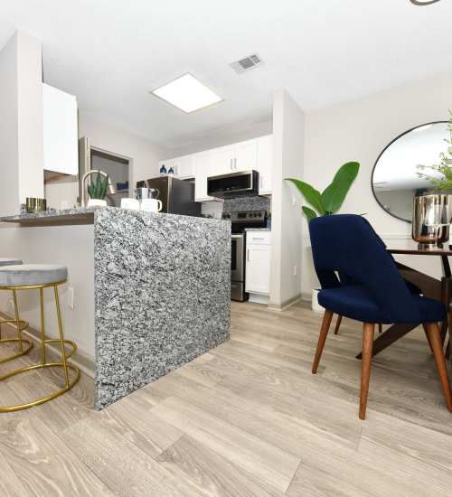 An apartment kitchen with granite countertops at Ascent Apartment Homes in Asheville, North Carolina