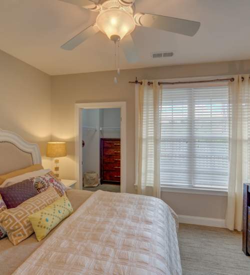 Bedroom with windows at Red Knot at Edinburgh in Chesapeake, Virginia
