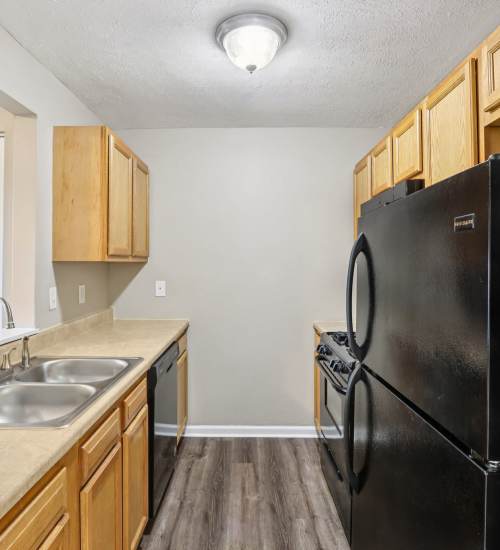 Kitchen with black appliances at Fox Pointe Apartments in Columbus, Indiana