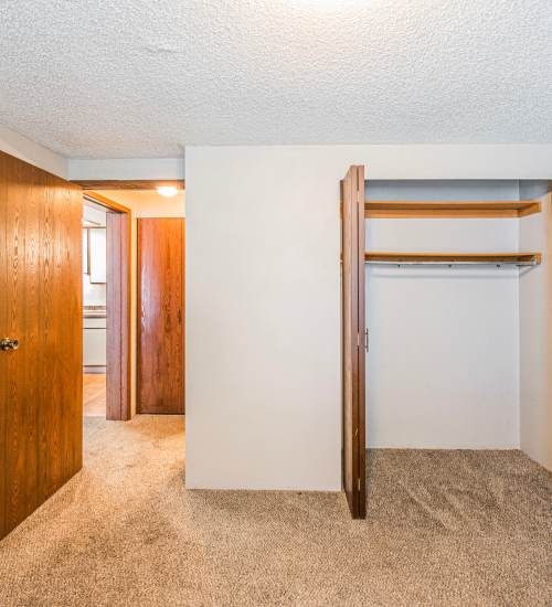 Bedroom with carpet and closet at Live Hilliard OH in Hilliard, Ohio