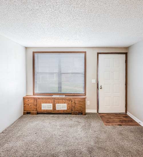 Living room with carpet and window at Live Hilliard OH in Hilliard, Ohio