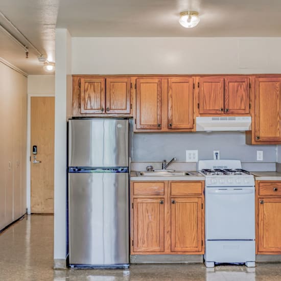 Kitchen with appliances at Guild House East in Philadelphia, Pennsylvania