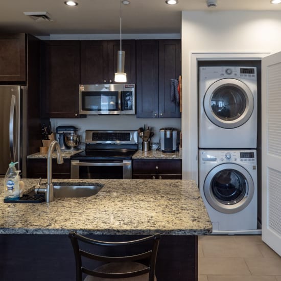 Kitchen and in unit laundry set up at The Lombardi in New Rochelle, New York