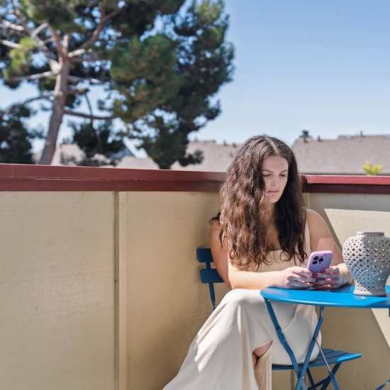 Woman working by the pool at Del Coronado in Alameda, California