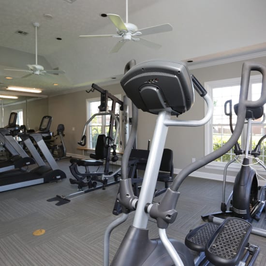 Well-equipped fitness center with treadmills and weight-lifting machines at Tapestry on Vaughn in Montgomery, Alabama