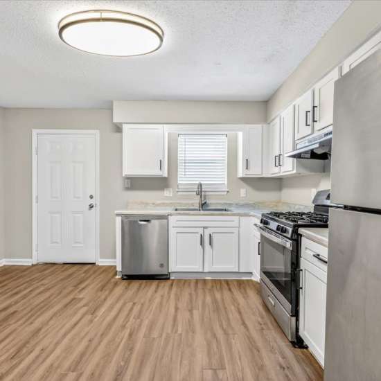 Kitchen with Stainless Steel Appliances at Tristan Townhomes in Garden City, Georgia