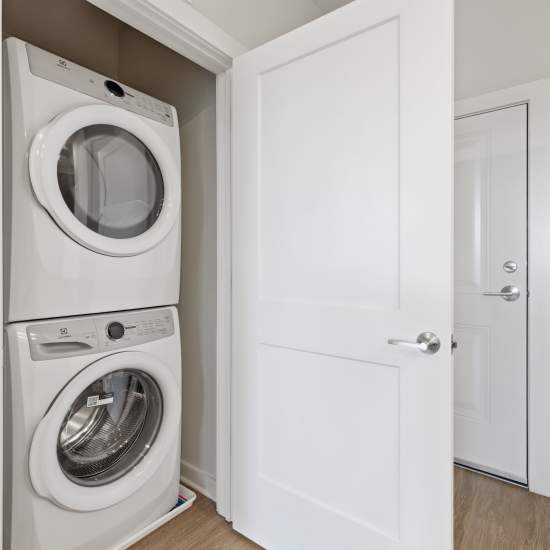 In unit stackable washer and dryer at The Warwick at Foundry Creek in Richmond, Virginia
