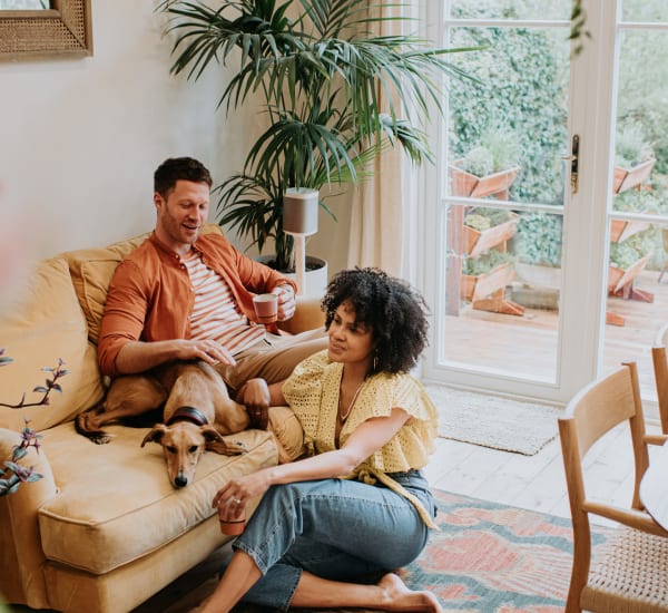 a couple sitting in their living room at Peak Management in Lutherville, Maryland