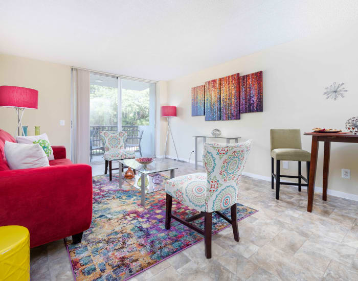 An apartment living room with wood-style flooring at Forest Place in North Miami, Florida