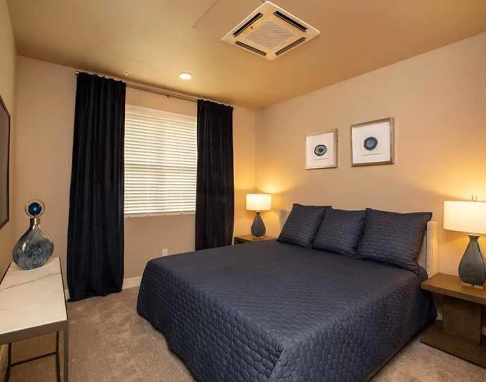 An apartment bedroom with soft carpet at Allure Apartments in Modesto, California