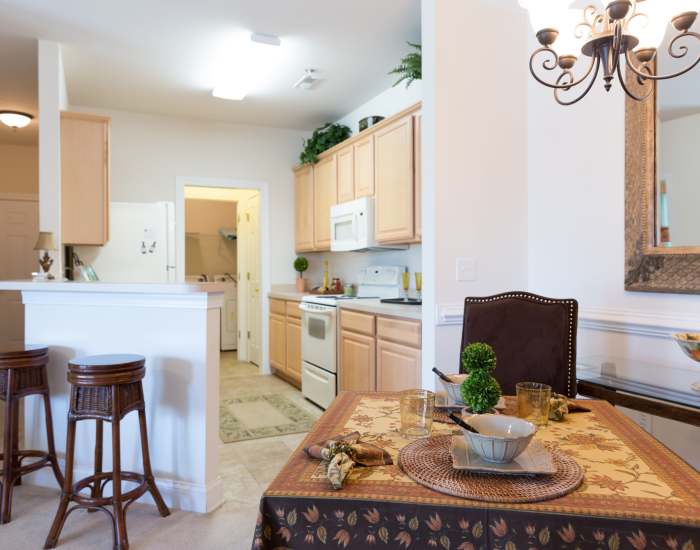 An apartment dining room and kitchen at Cloisters at Carolina Forest in Myrtle Beach, South Carolina