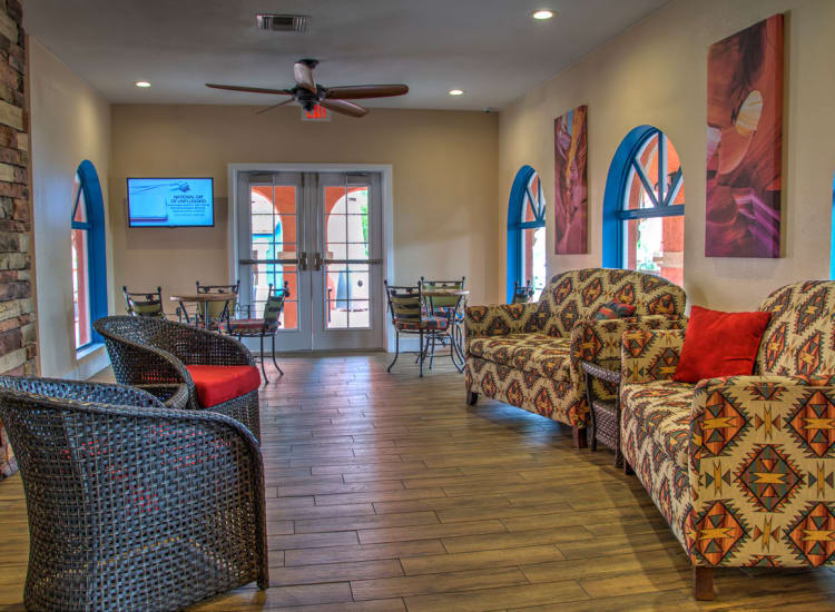 Relaxing seating in front of the fireplace at Casa Del Rio Senior Living in Peoria, Arizona