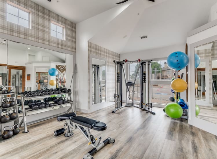 Fitness center with weights at The Heights in Arlington, Texas