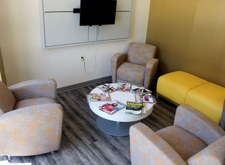 Seating area with flat-screen TV at Bixby Brockton Apartments in Brockton, Massachusetts, 