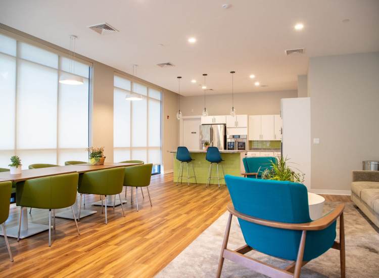 Clubhouse kitchen with wooden flooring at Hearth at Four Corners in Dorchester, Massachusetts, 