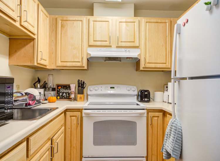 Kitchen with energy efficient applinaces at Lowell Belvidere Apartments in Lowell,Massachusetts