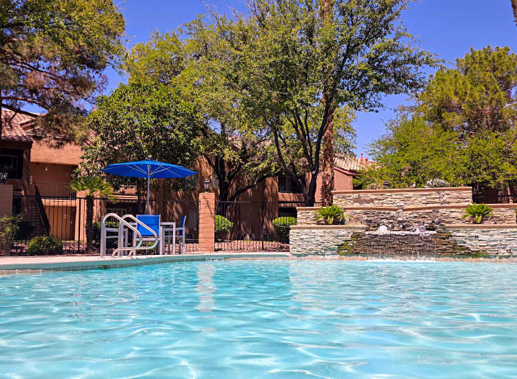 Resort-style swimming pool with a fountain and spa at Alterra Apartments in Las Vegas, Nevada