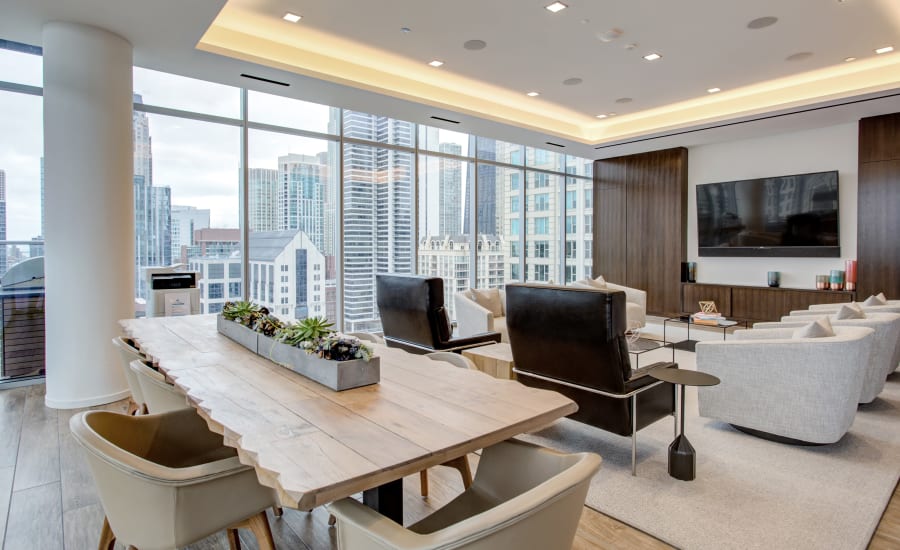 Indoor community lounge with a Smart TV at Residences at 8 East Huron in Chicago, Illinois