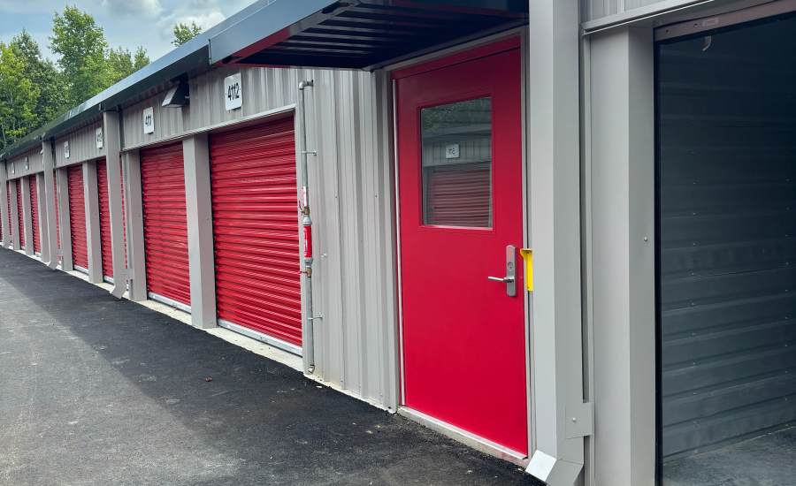 Exterior view of storage units and climate control covered entry door at Storage Authority Carolina Road in Suffolk, Virginia