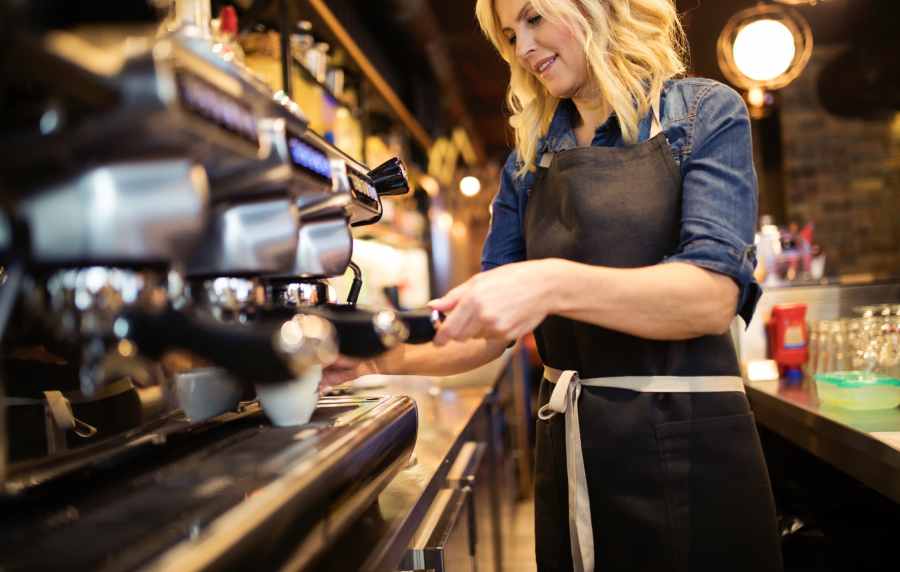 Barista making coffee drinks at a café near The Southerly at St. Augustine in St Augustine, Florida
