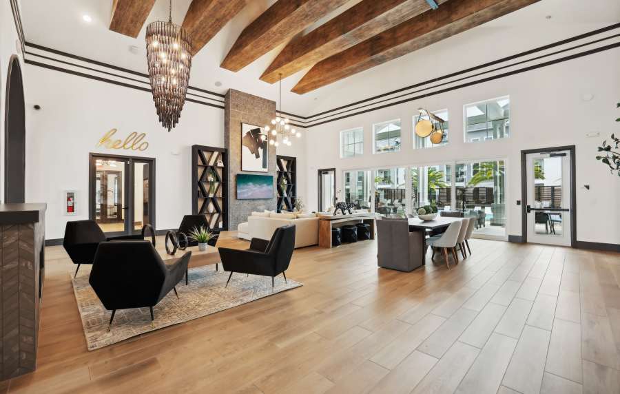 Comfortable seating and raised ceiling in the clubhouse at The Southerly at Orange City in Orange City, Florida