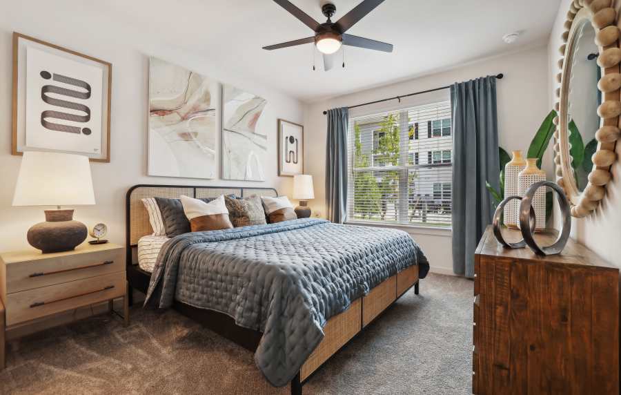 A well-made bed in a model apartment at The Southerly at Orange City in Orange City, Florida