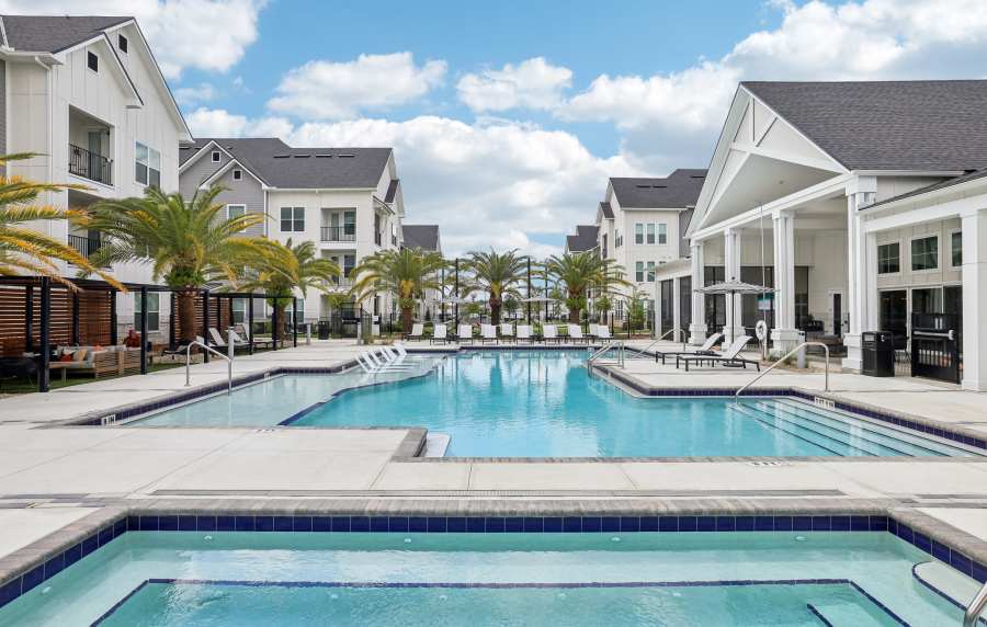 The community swimming pool at dusk at The Southerly at Orange City in Orange City, Florida