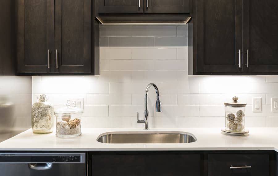 Kitchen with beautiful backsplash at Altair At The Preserve in O'Fallon, Missouri 