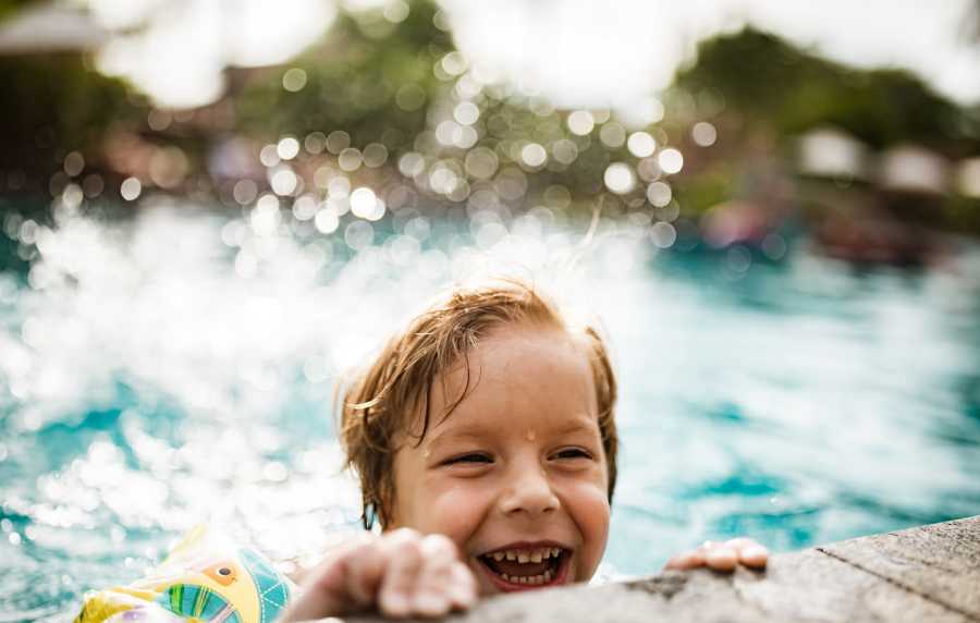 Resident child in pool at Greer Mill Residences in Greer, South Carolina