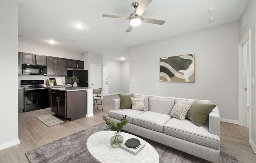 Cozy living room with a comfy couch at The Janson in Del Valle,Texas