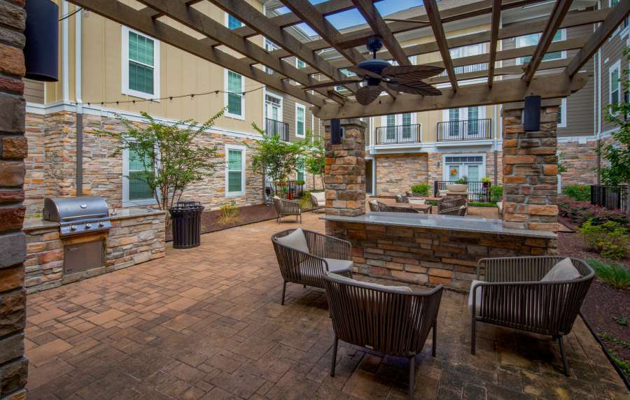 Picnic area with BBQ grill at Red Knot at Edinburgh in Chesapeake, Virginia