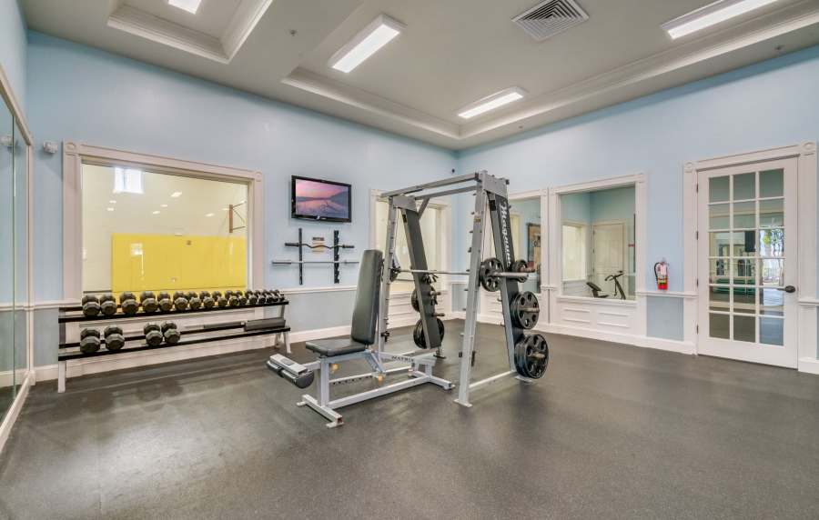 Community fitness center at Victoria Park Apartments in Davenport,Florida