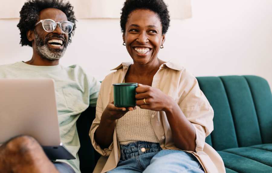Happy couple in living room at Walnut Springs in Seguin, 