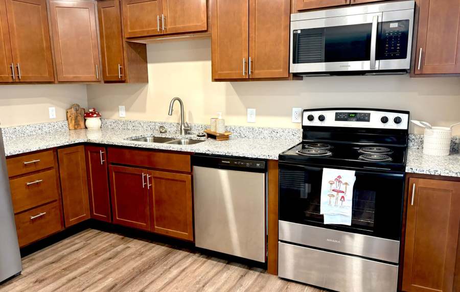 Kitchen room with modern appliances at Charleston Square Apartments in Columbus, Indiana