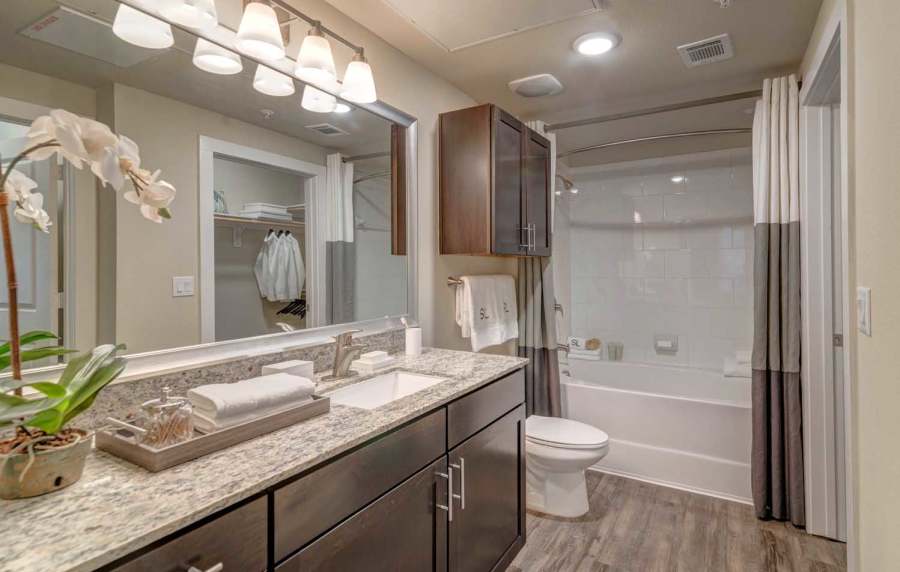 Bathroom with large vanity at Southfork Lake in Manvel, Texas