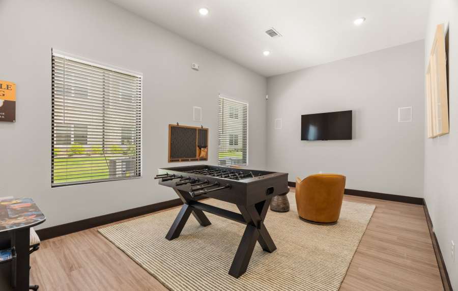 Resident lounge with foosball table at Walnut Springs in Seguin, Texas