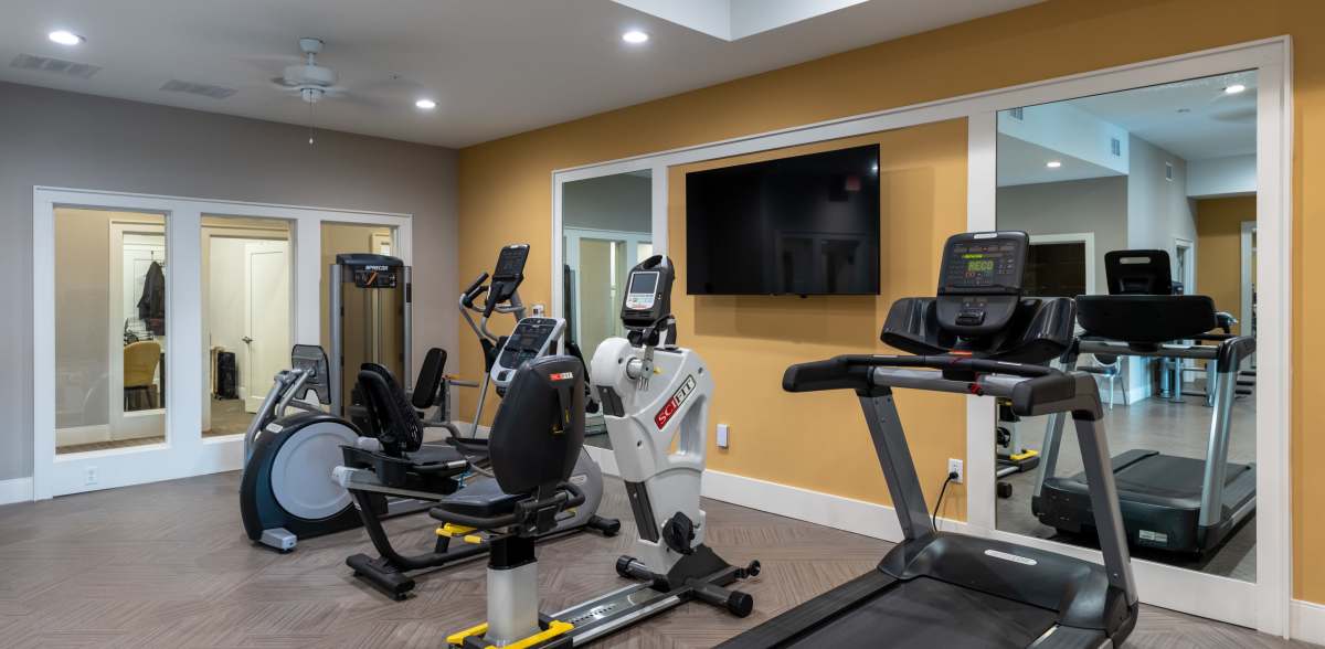 Gym with treadmill and other equipment at Acclaim at East Beach, Norfolk, Virginia